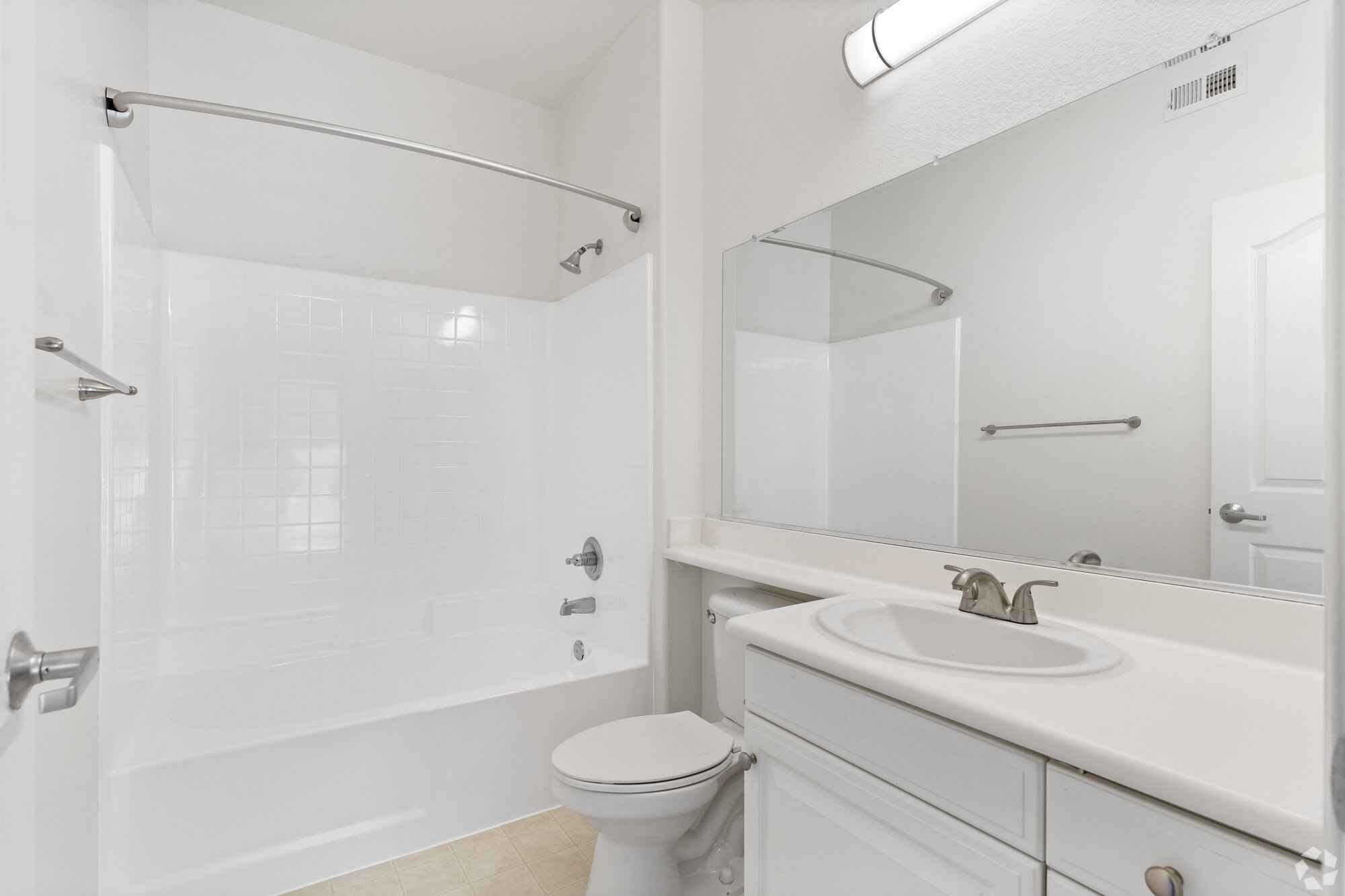 bright bathroom with vanity mirror at Via Ventura
